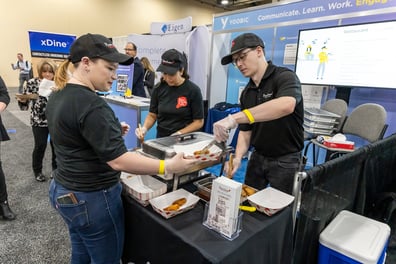 Bonchon team making fried chicken on YOOBIC booth at FSTEC